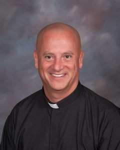 Father Zach Etienne